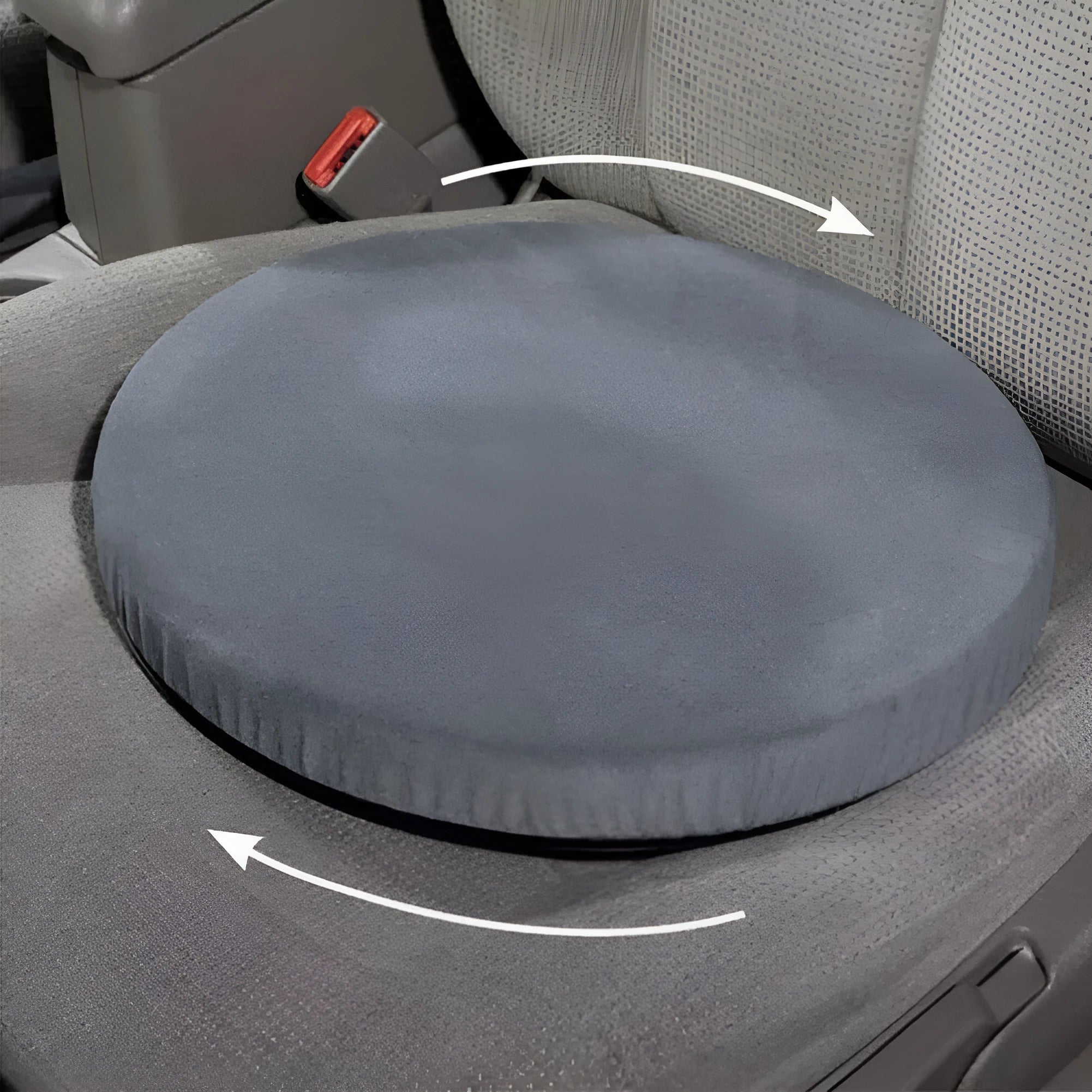 A grey 360-degree rotating car seat cushion on a car seat, showing its non-slip base and plush fabric cover.