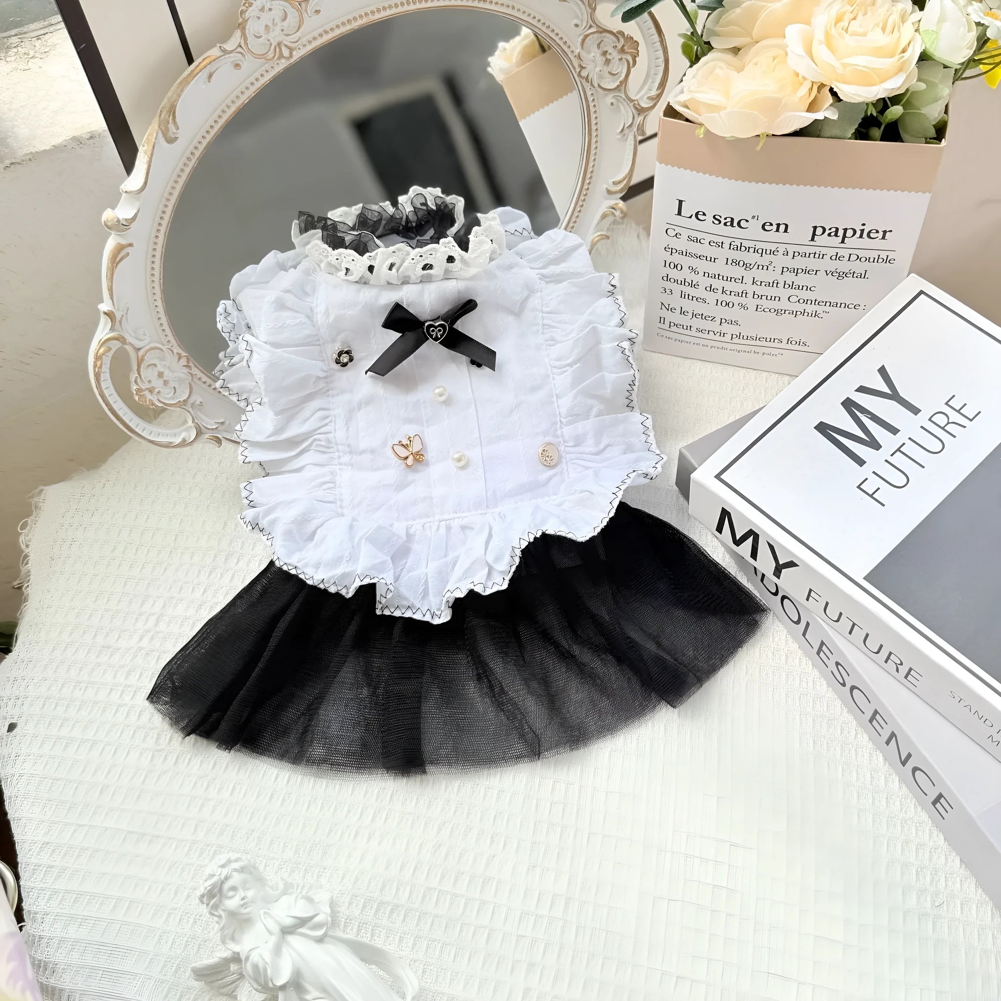 White polyester gauze skirt dog dress on a small dog, showing princess-style gathered skirt.