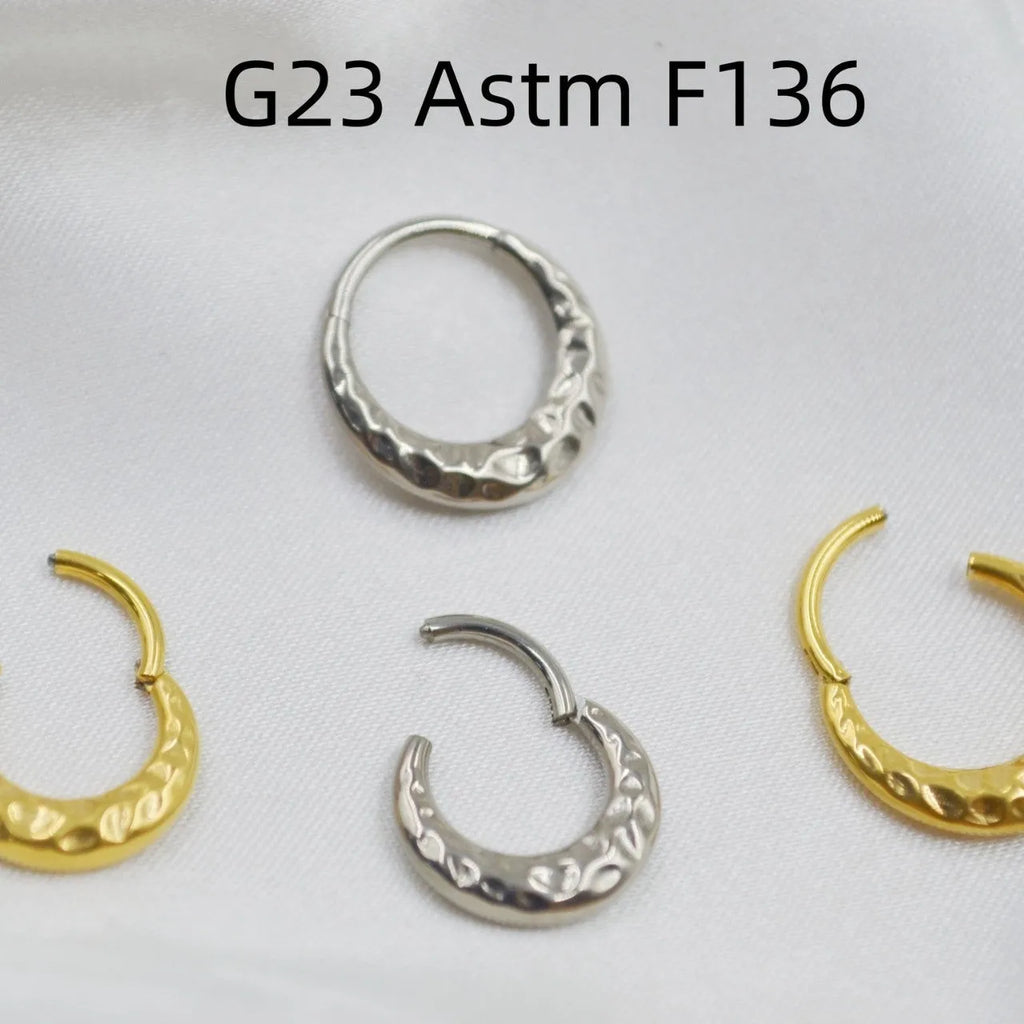 Titanium alloy concave-convex nose ring with carved surface in gold or silver colour, showing 1.2x8mm and 1.2x10mm size options