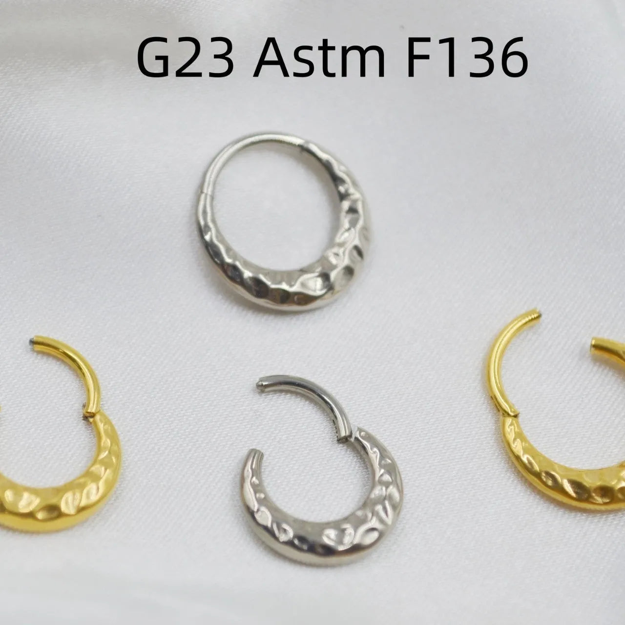 Titanium alloy concave-convex nose ring with carved surface in gold or silver colour, showing 1.2x8mm and 1.2x10mm size options