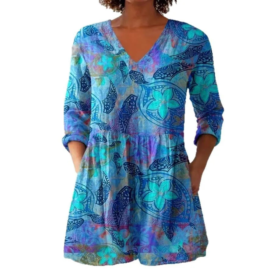 Women's retro patterned long-sleeved top with V-neck on a hanger