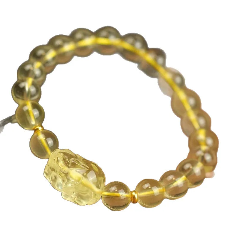 Yellow leather adjustable bracelet with a citrine Pi Xiu crystal charm in Chinese simple style.