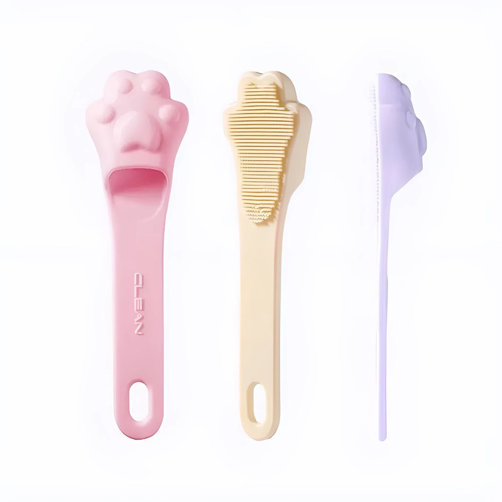 Pink silicone finger cover toothbrush for pets on a white background