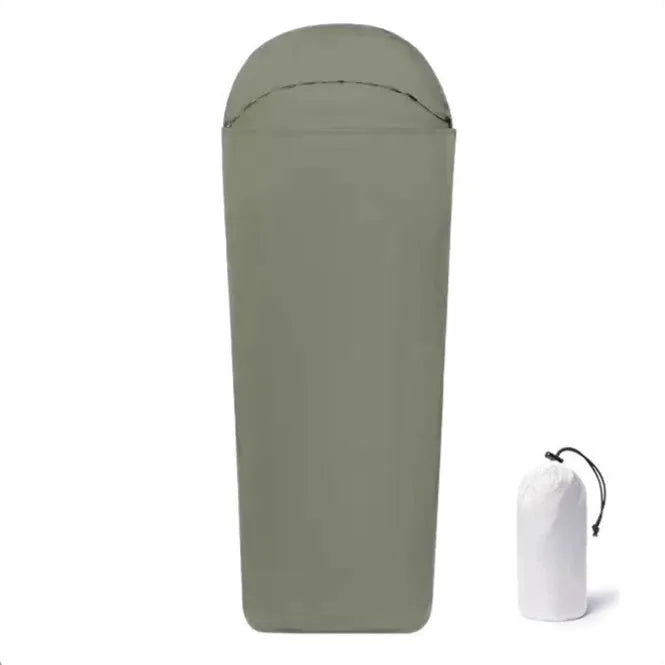 Blue lightweight mummy-style nylon sleeping bag with tapered foot, shown rolled up for travel.