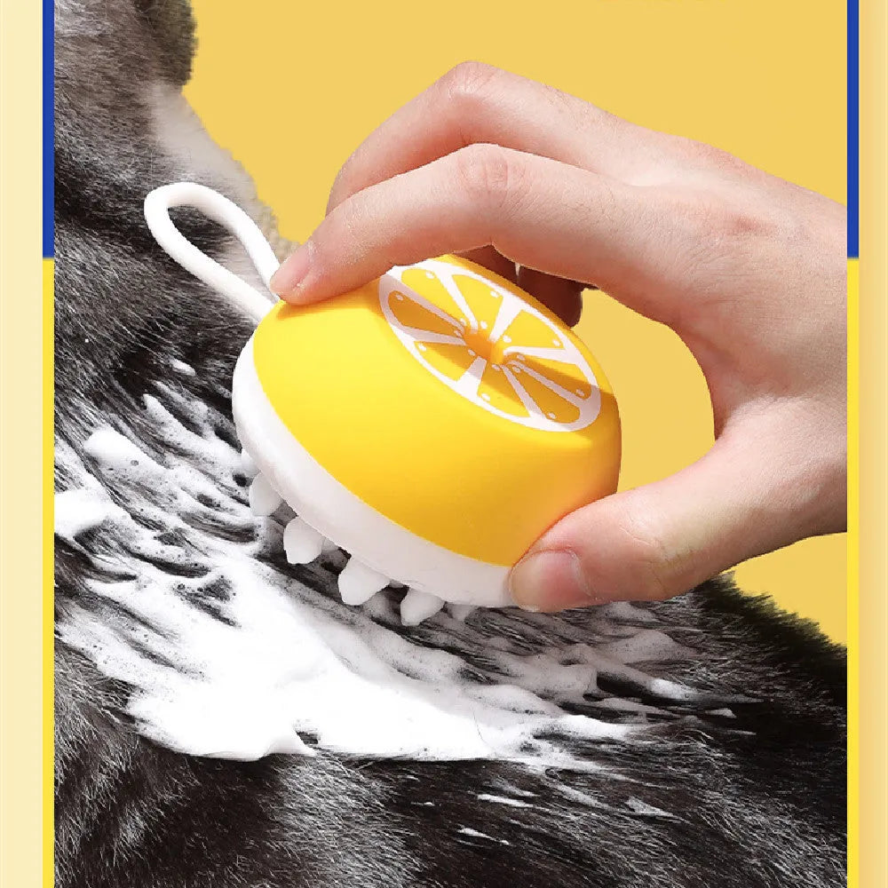 Yellow silicone pet bath brush and grooming comb tool with a 3D massage head on a blue background.