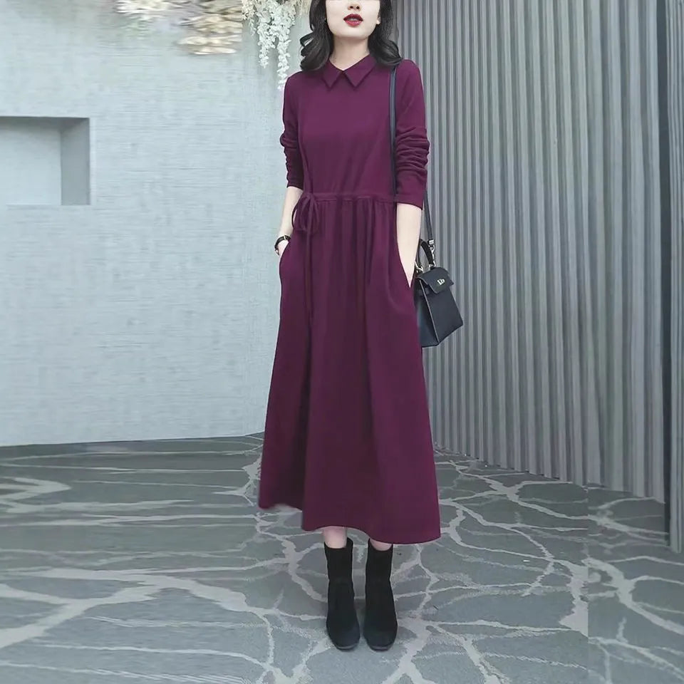 A purplish red plus size women's long sleeve dress with a long skirt for autumn and winter.