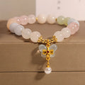 Women's crystal bracelet with butterfly pendant featuring natural morganite stones in candy colours