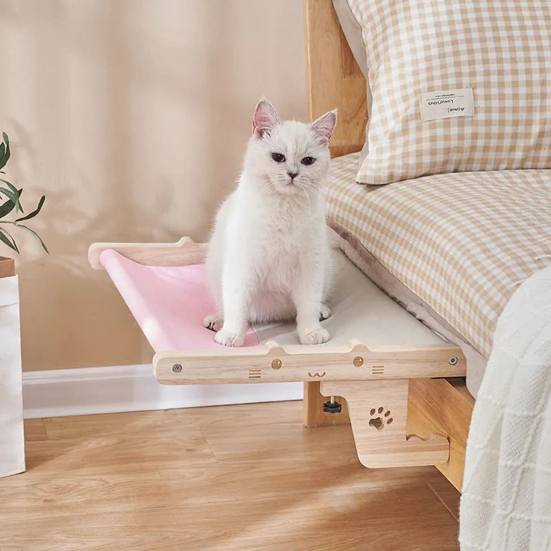 Wooden cat hanging bed mounted on window with suction cups, hammock-style pet sleeping area