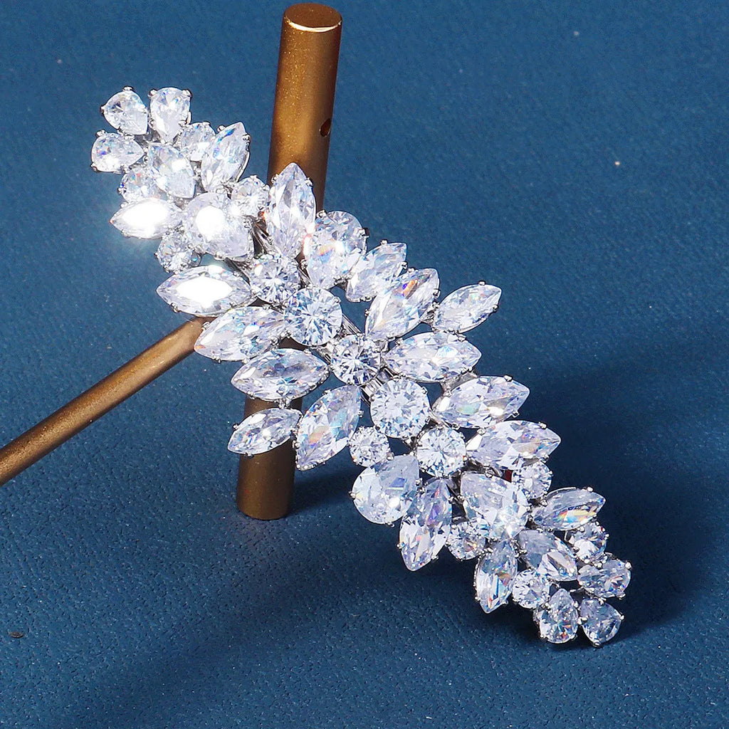 Women's inlaid zircon spring clip barrettes with electroplated leaf design on a neutral background