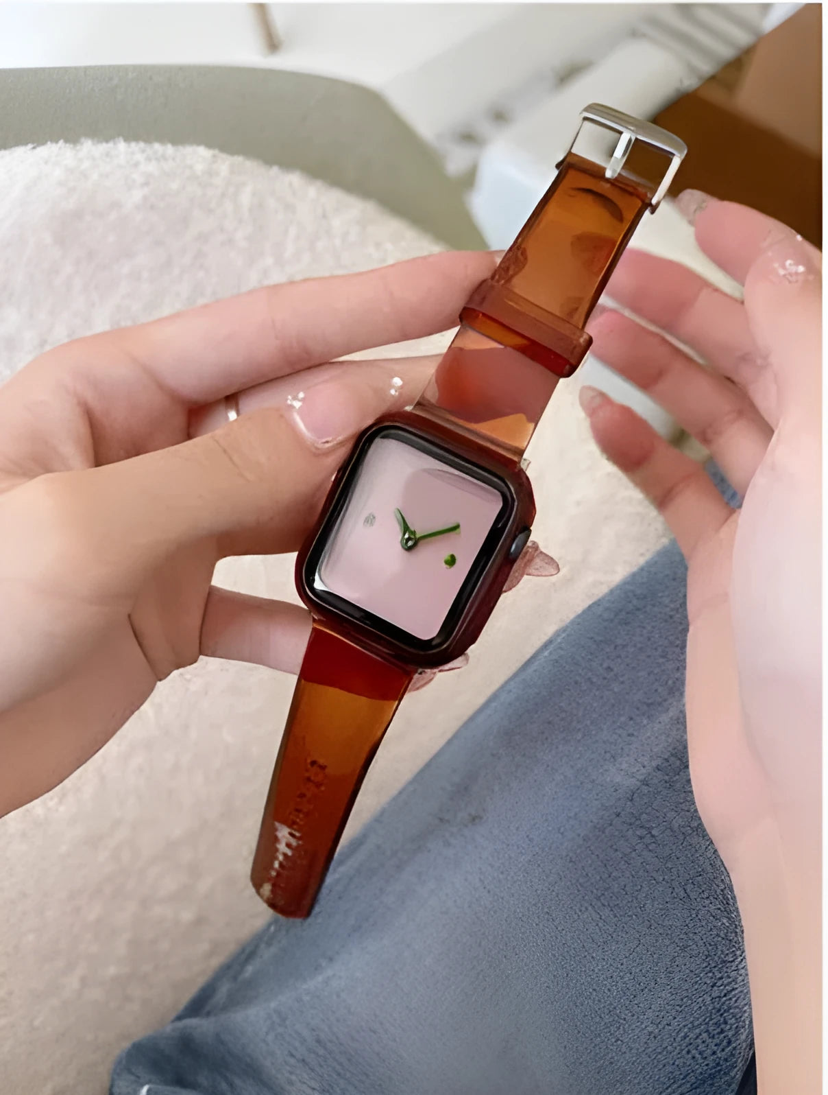 Brown transparent silicone replacement strap for Apple Watch, showing connector for compatible models.