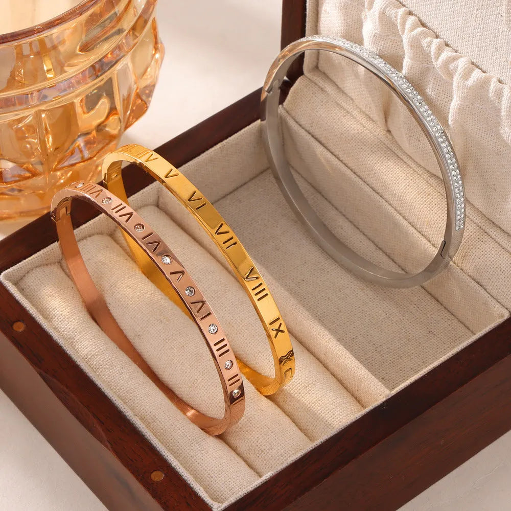 Retro Roman numeral titanium steel gold-plated bracelet with diamond accents on wrist