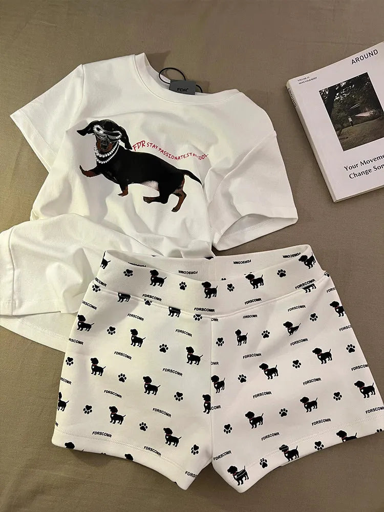Girls short sleeve pyjama set with sausage dog print and sunglasses design in polyester