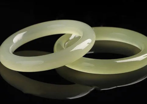 Round bar jade bracelet showing natural stone patterning with size measurement guide