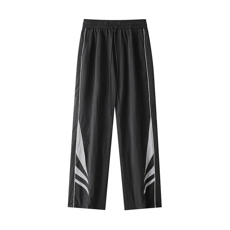 Men's straight-leg grey cotton blend sports trousers with an elasticated waistband laid flat.