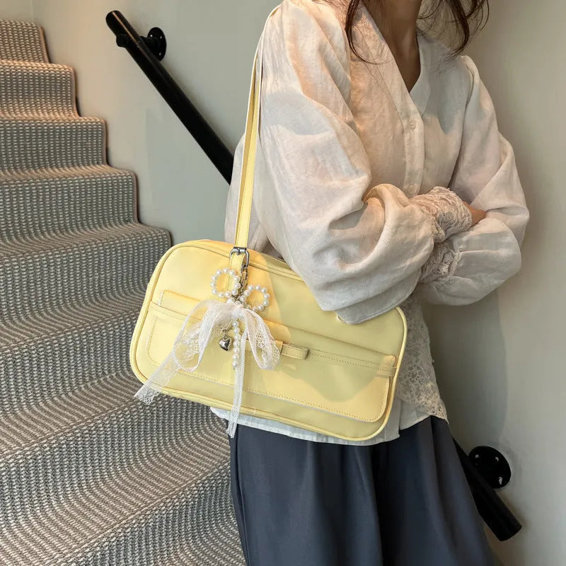 PU leather single shoulder flap bag in horizontal square shape with double straps and pearl bow decoration