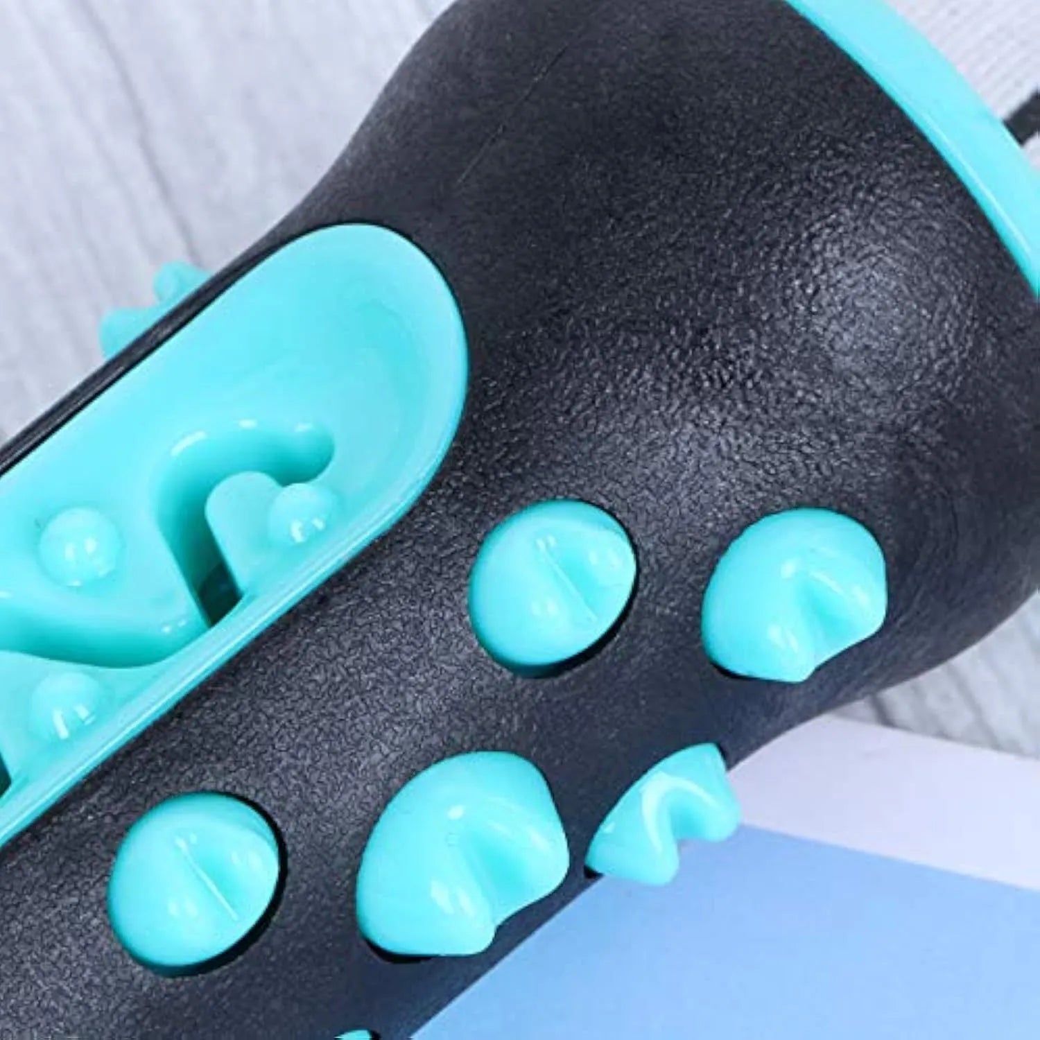 Natural rubber dog dental chew toy in blue, showing textured cleaning surface and size.
