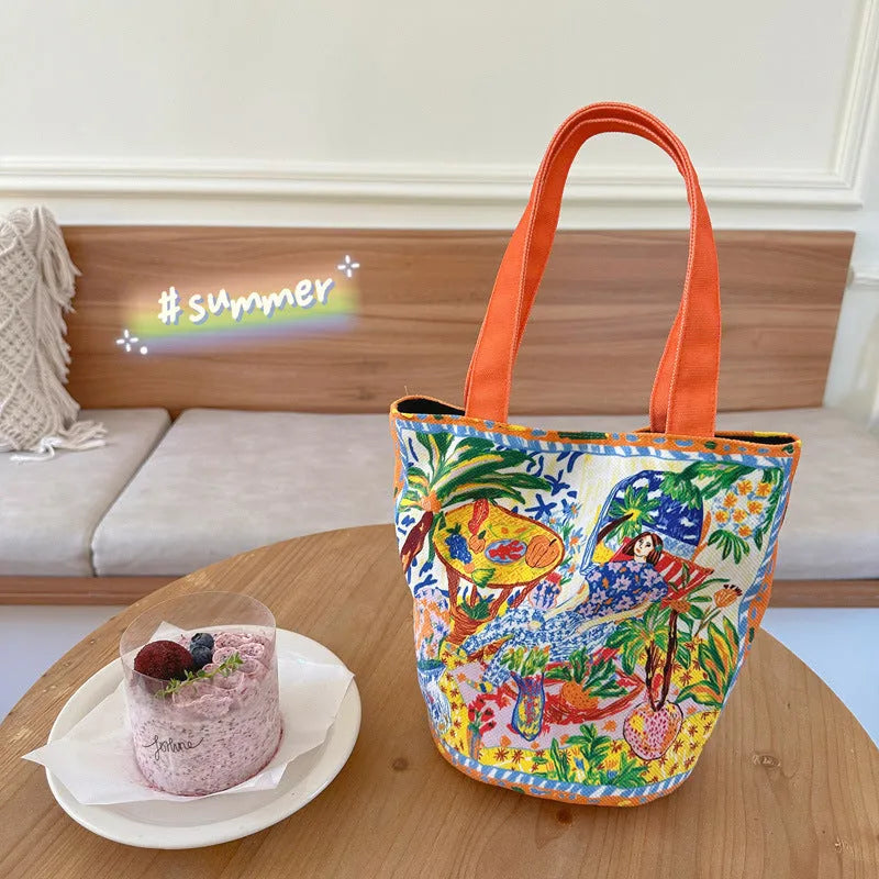Orange canvas bucket handbag with double shoulder straps and printed letter design