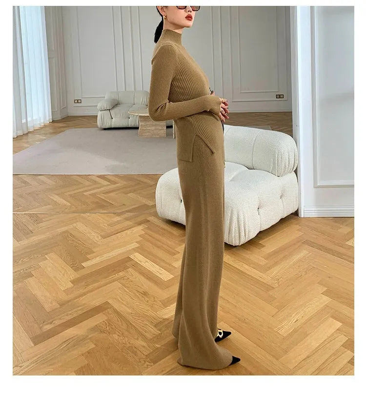Women's apricot knitted three-piece set with wide-leg trousers, top, and long cardigan on a hanger.