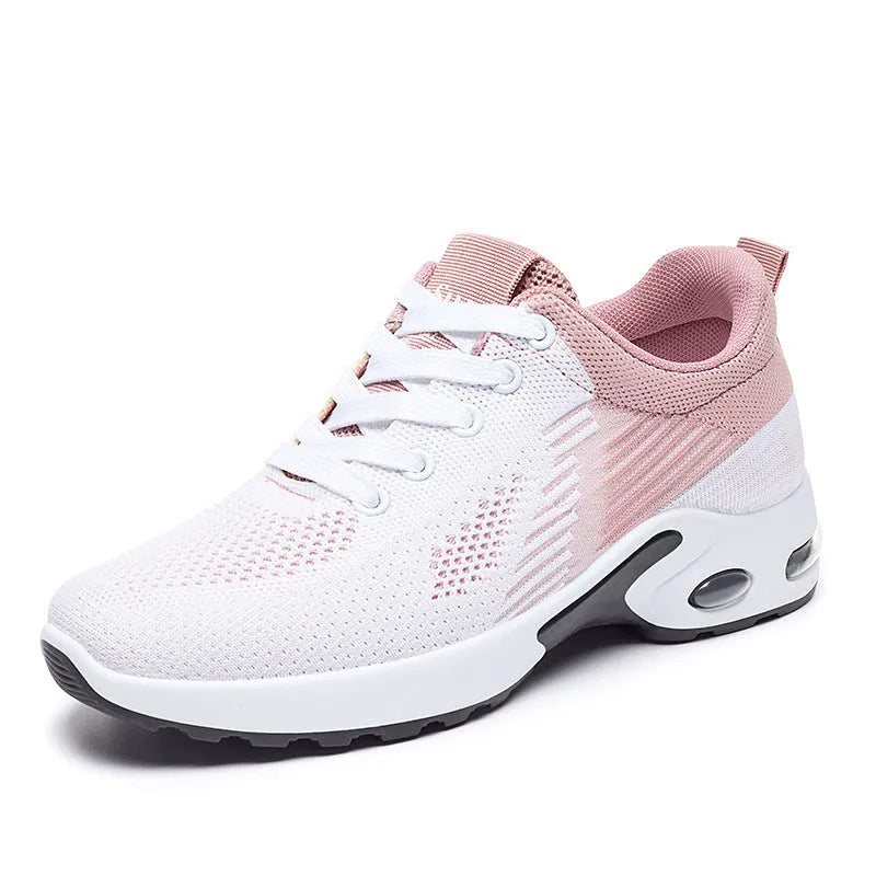 Women's striped Flyknit casual running shoes in pink, shown with flat heel and lace-up front.