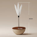 Auto-balancing cat interactive food puzzle toy in tumbler style on a floor
