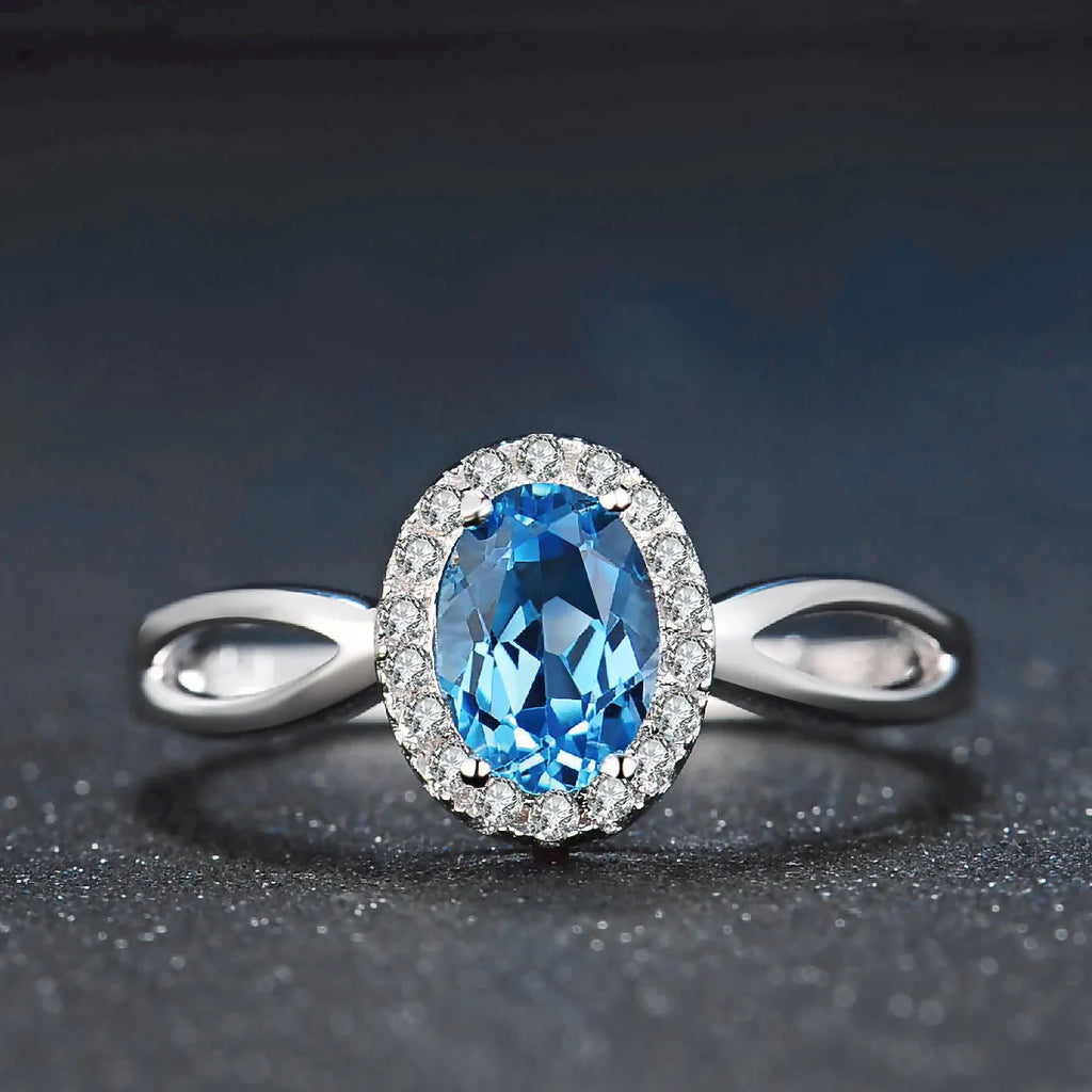 925 sterling silver geometric jewellery set with blue topaz gems including earrings, ring, necklace and pendant
