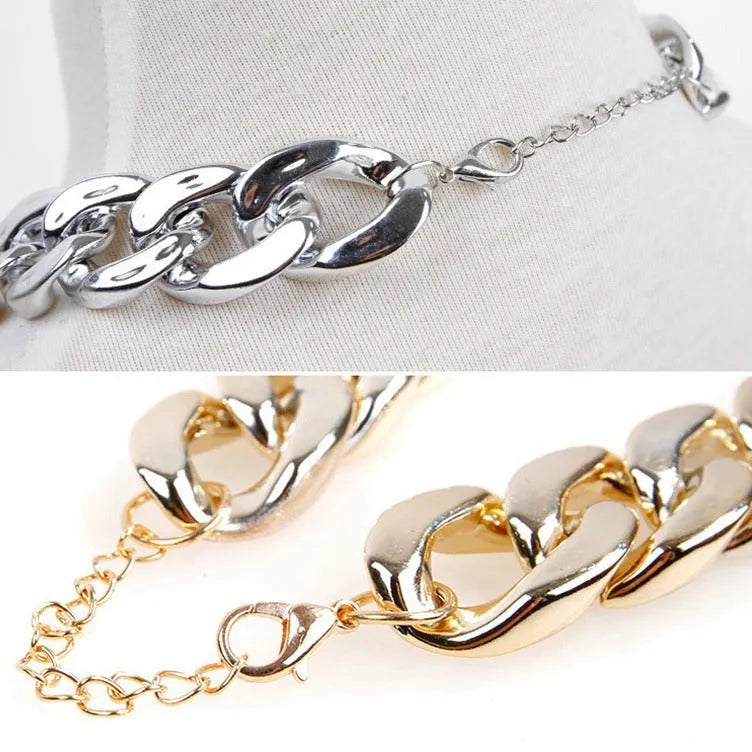 A gold chain-link style dog collar ornament on a white background.