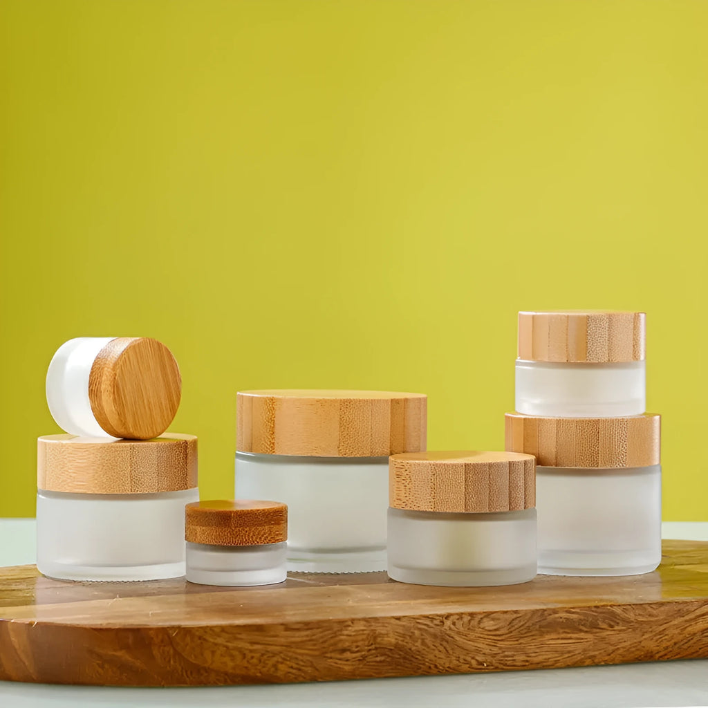 Refillable glass cream jar with bamboo wood lid, transparent finish, 100g capacity