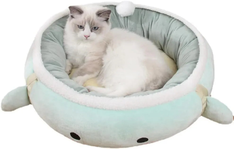 Green chick-shaped cat bed that can be used flat or hung as a hammock for a small cat.