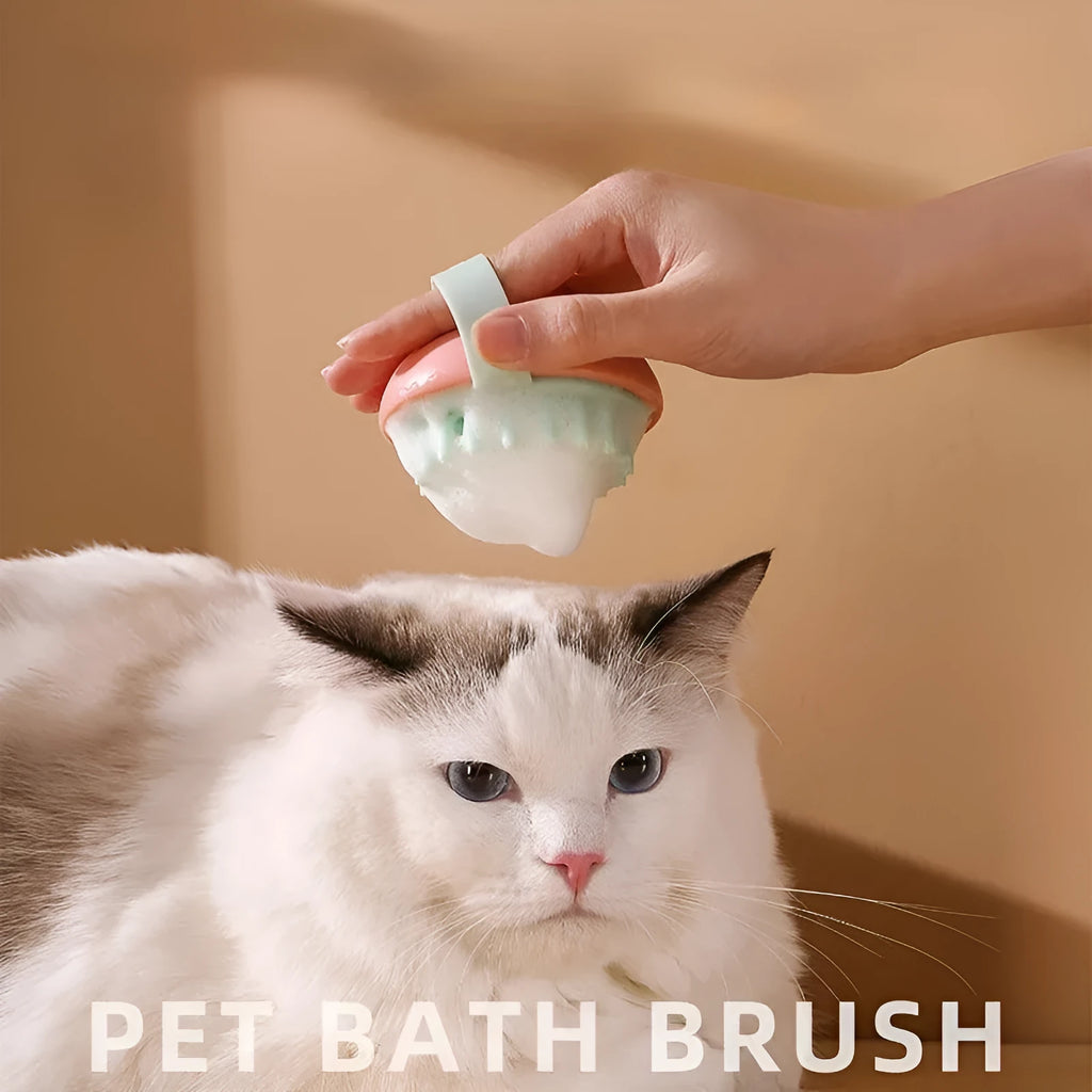 Blue silicone pet bathing and grooming brush with soft bristles and an ergonomic handle.