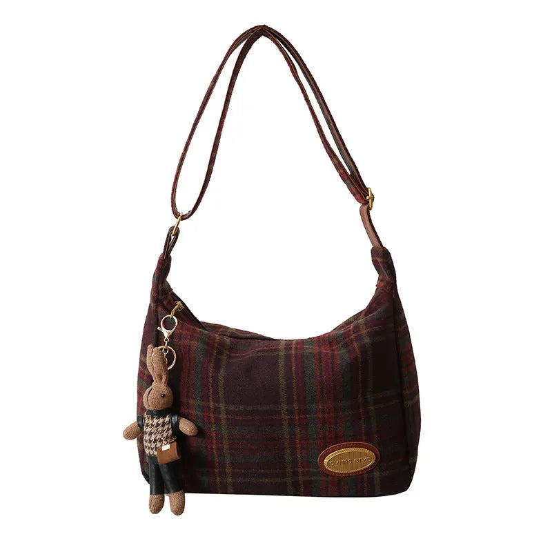 Women's large soft woolen cross-body shoulder bag in a horizontal square shape, shown in a choice of colours.
