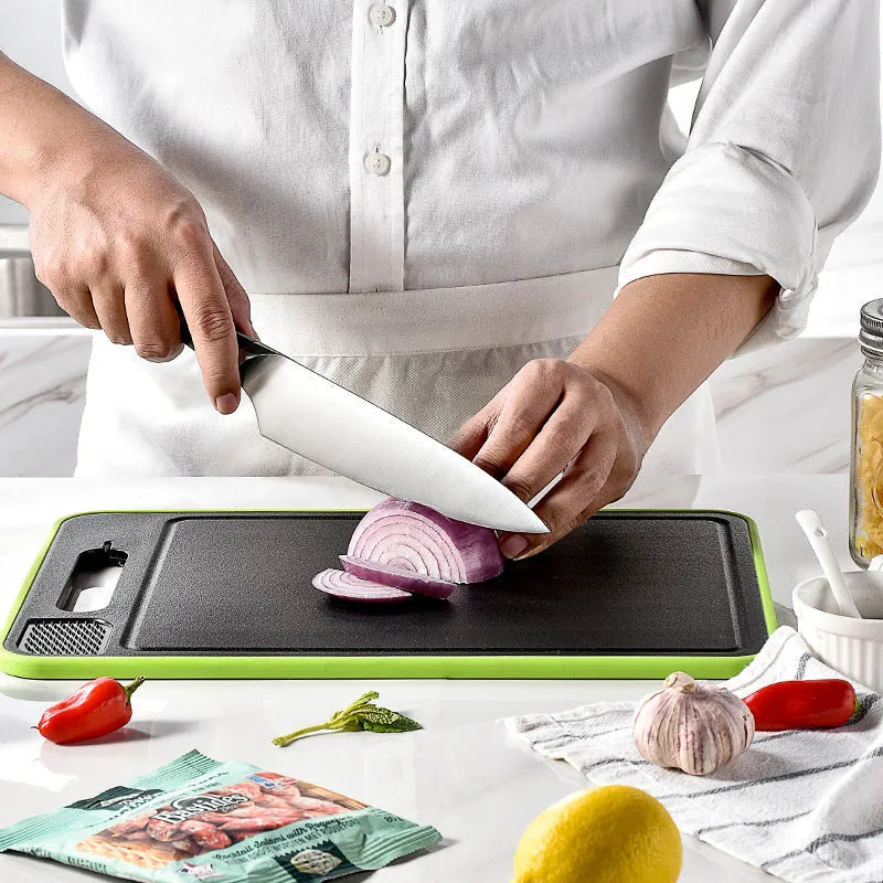 Grey square aluminium cutting board with double sides showing grinding teeth and built-in knife sharpener