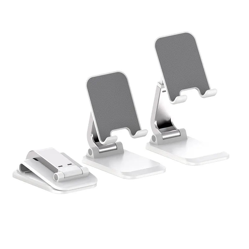 Foldable aluminium alloy phone holder in black on a wooden desk with a smartphone propped up for viewing
