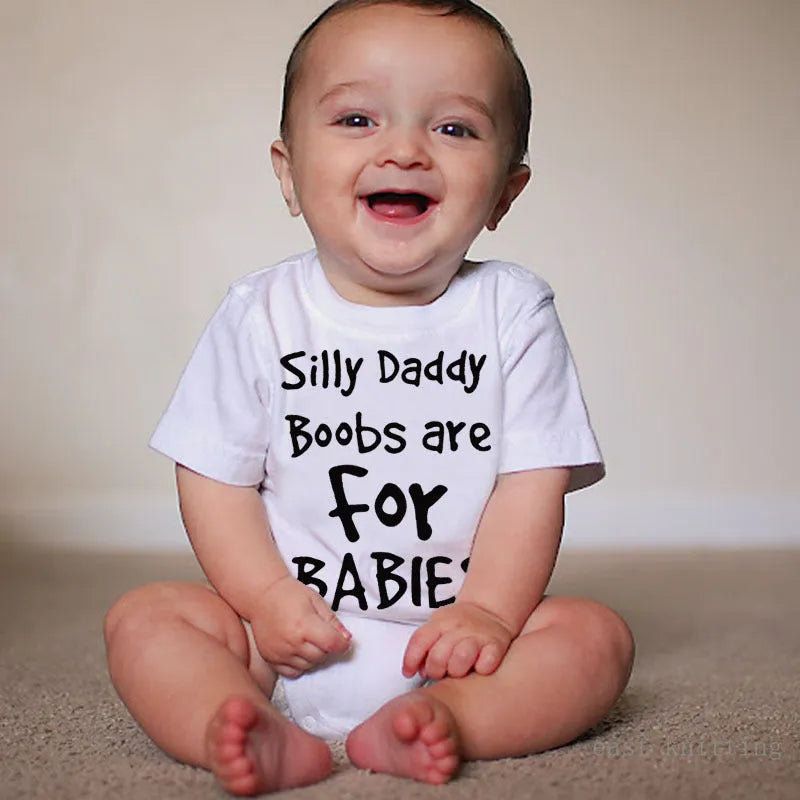 White triangle climbing vest top with printed text 'Silly Daddy Boobs Are For Babies' on the front