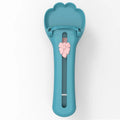 Green and pink pet food dispenser spoon with silicone squeezer tube for liquid cereal feeding
