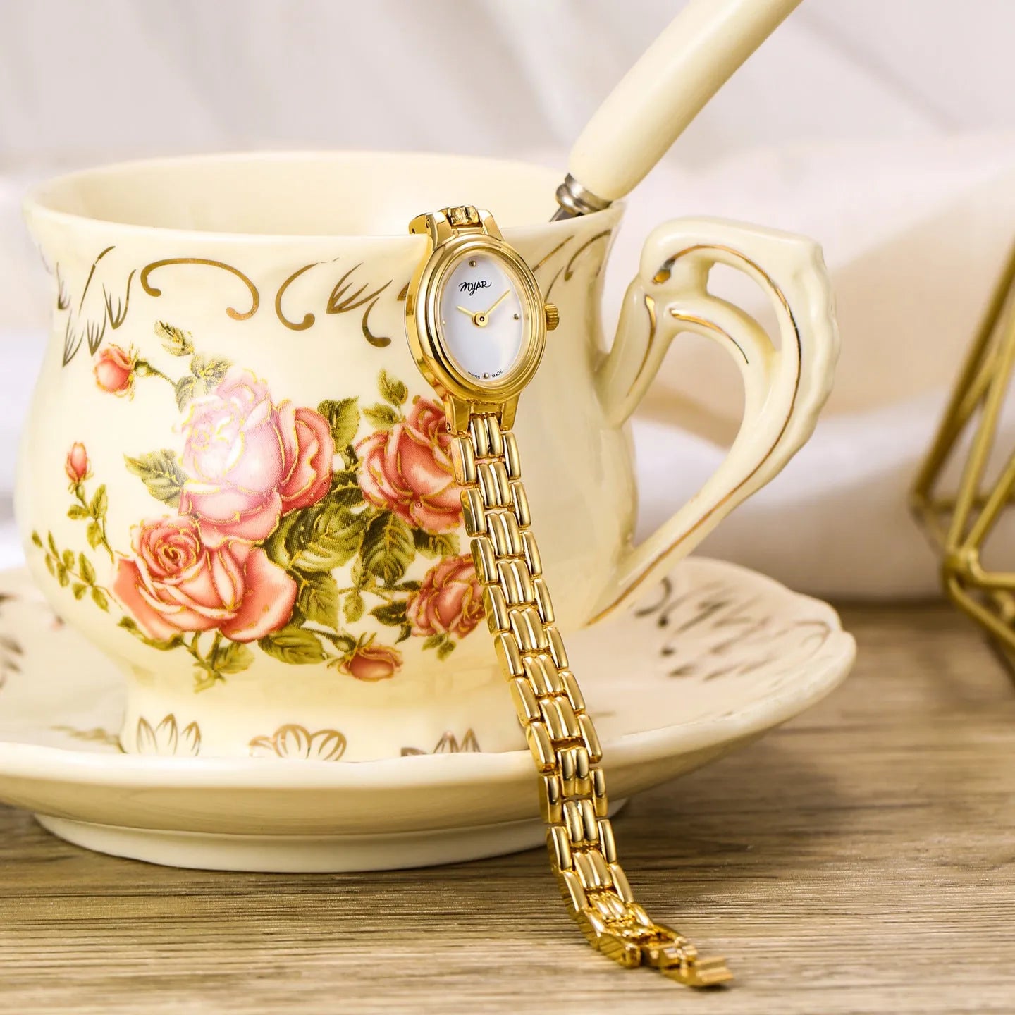 Oval mini women's vintage quartz watch with gold alloy case, white dial, and jewellery buckle