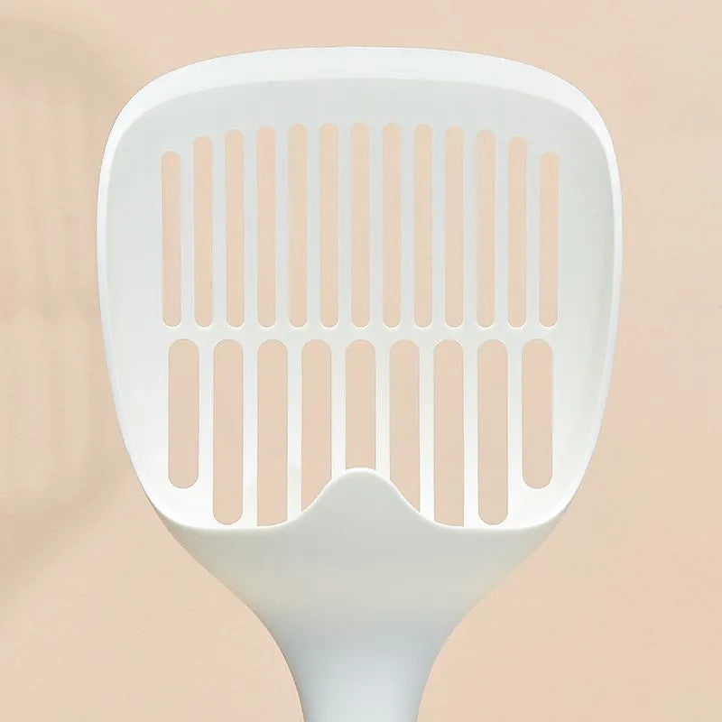 White plastic cat litter scoop with storage base for containing tool between uses