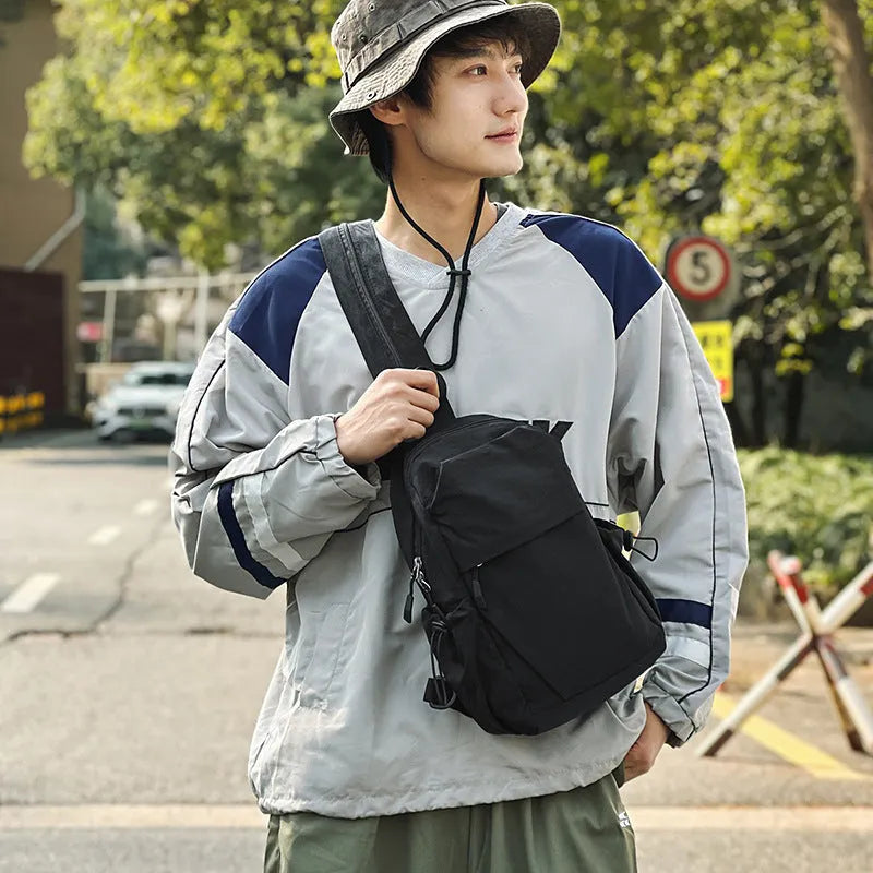 Waterproof nylon backpack in black, green, grey, or white, free size, crossbody or chest bag for outdoor travel.
