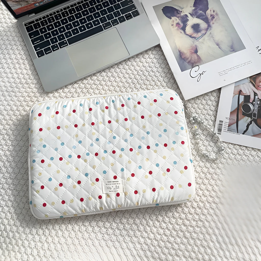 Women's polka dot laptop bag in polyester with breathable construction showing size options