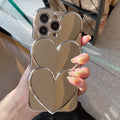 Flexible TPU iPhone case with a silver electroplated three-dimensional love design on the back.