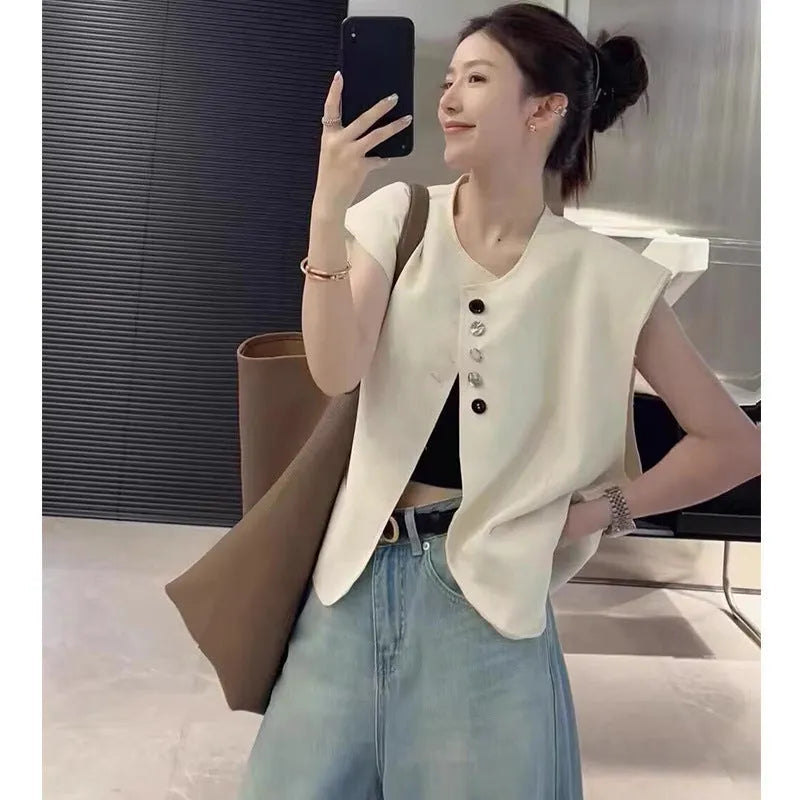 Women's loose-fit polyester vest in solid colour with a pocket, shown in milky white.