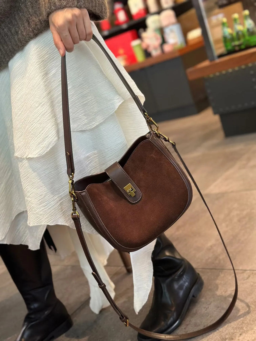 Women's black genuine leather crossbody bag with one-shoulder design and sandwich pocket exterior