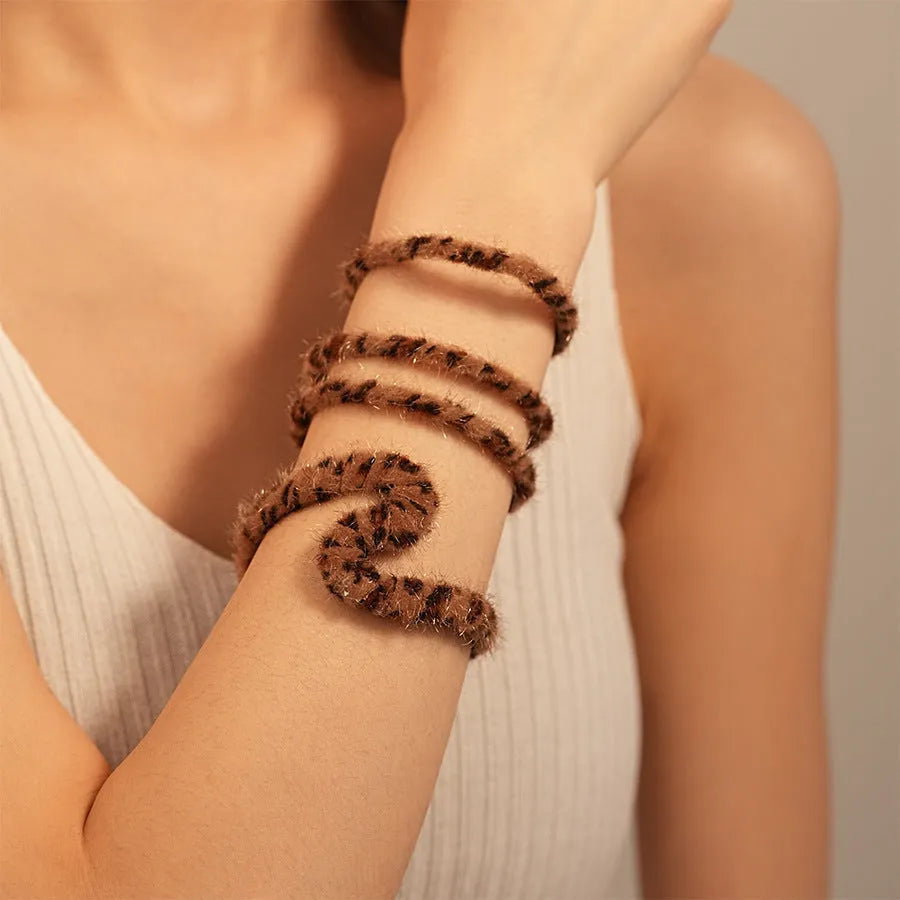 Geometry pattern twisted open-ended bracelet in 22 Silver Blue alloy with electroplated finish