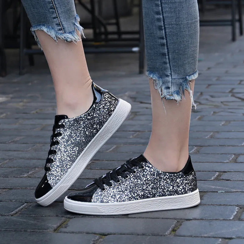 Women's low-top casual shoes with colourful sequin upper, round toe, and lace-up front in black, gold, or pink.