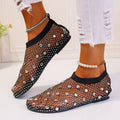 Women's white and colourful mesh flat sandals with rhinestone decoration and a round toe.