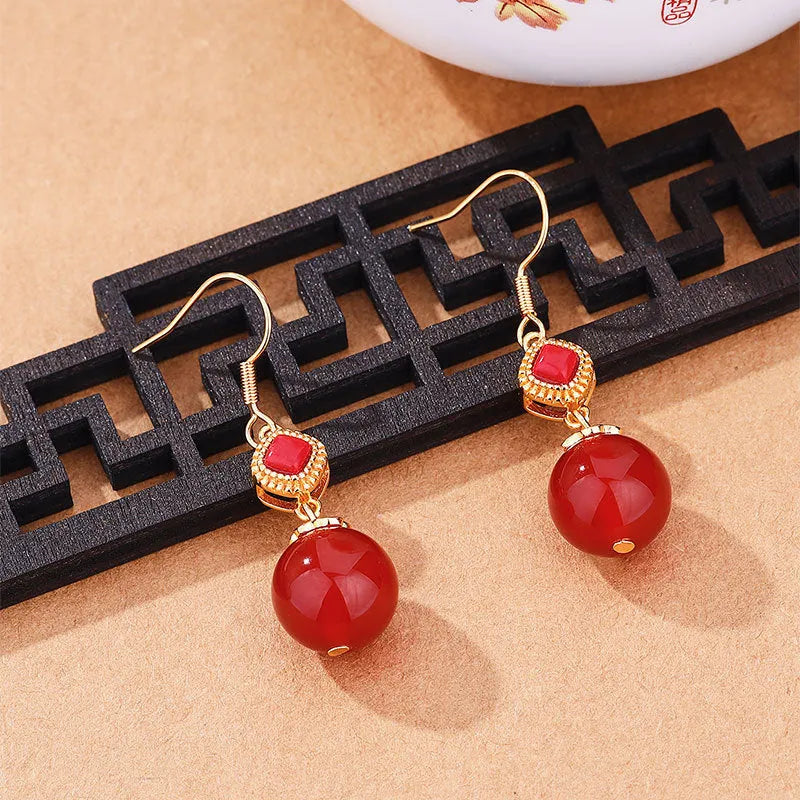 Geometric copper alloy earrings with round red agate beads and S925 silver jasper inlay.