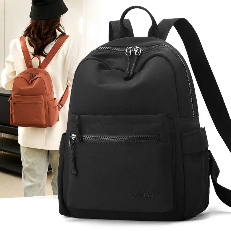 Women's Oxford cloth casual travel backpack in Classic Black with adjustable straps and casual design