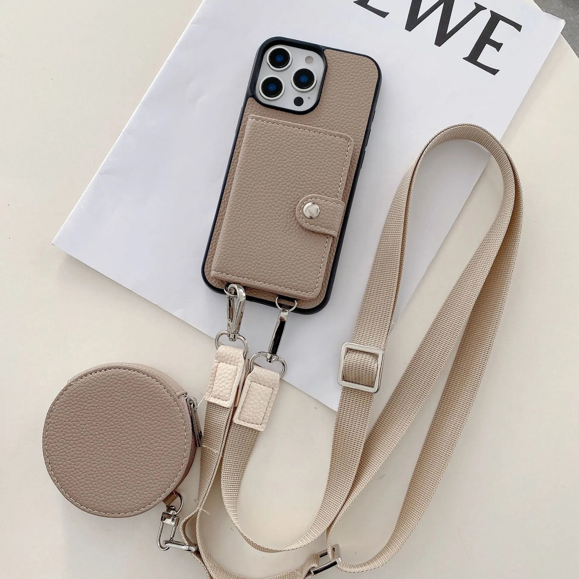 Black PC leather phone case with card slot and attached lanyard for iPhone, shown alongside credit cards.