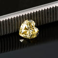 Lemon yellow heart-shaped moissanite gemstone showing precise cut and dimensions