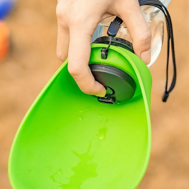 Portable pet water bottle with drinking bowl in sky blue, showing key lock and wide sink design.