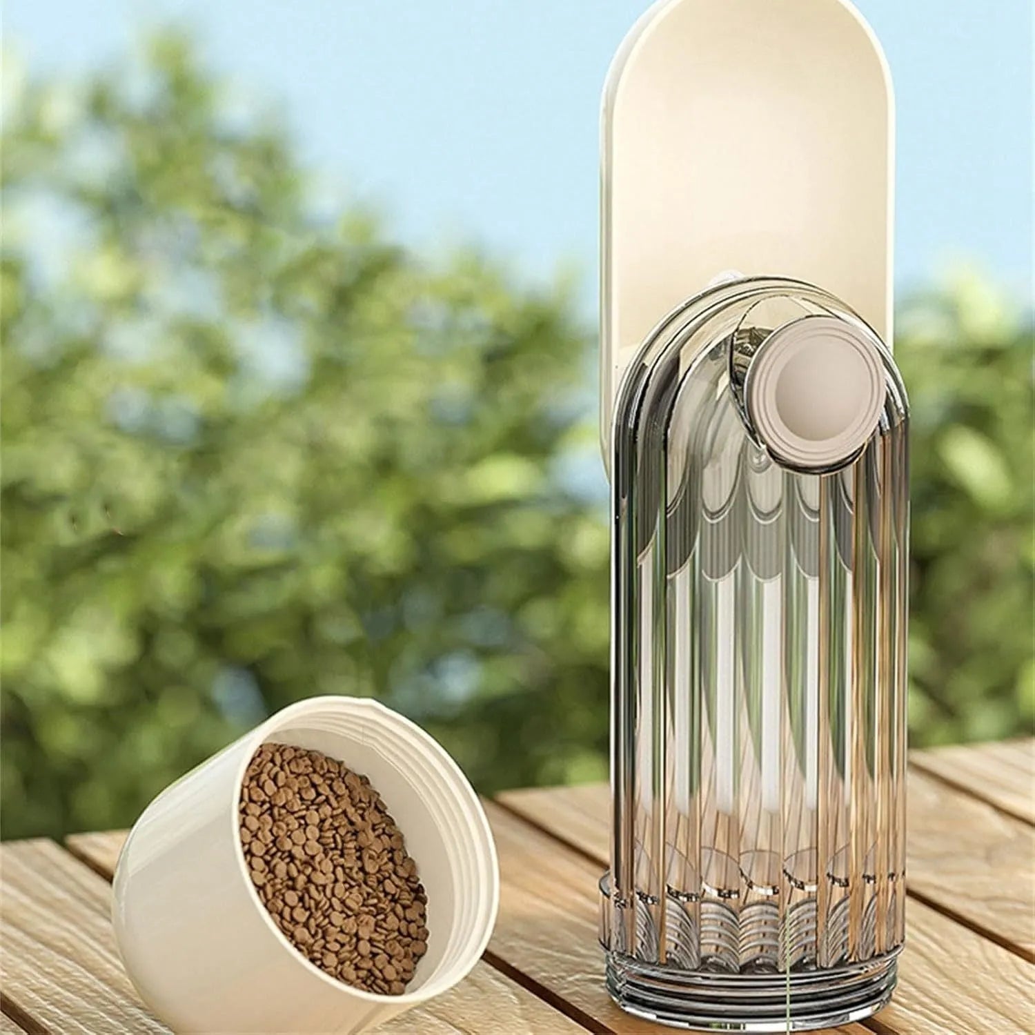 Foldable dog water bottle with food dispenser in beige or green colours for outdoor walking and hiking